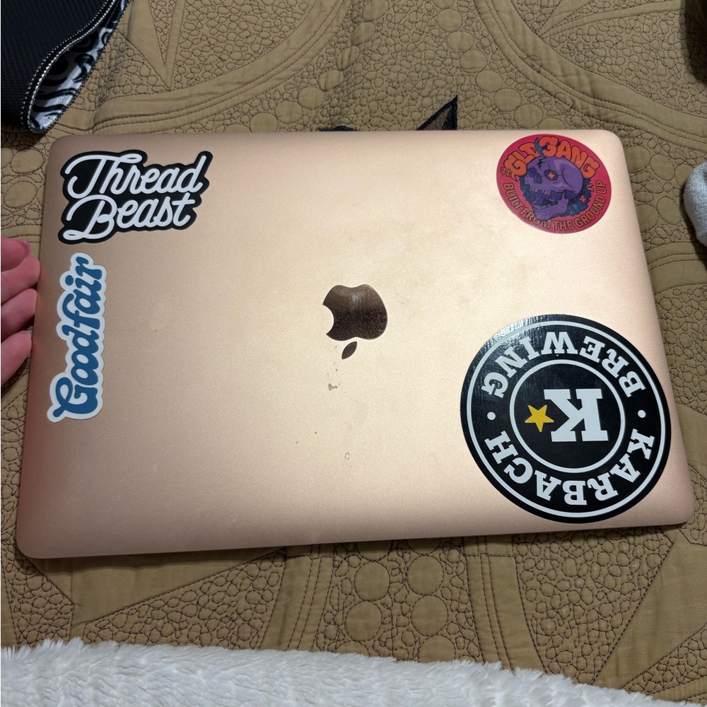 Apple MacBook in Gold with Unique Stickers